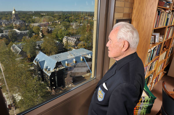 Hesburgh surveying campus from his Library-based office