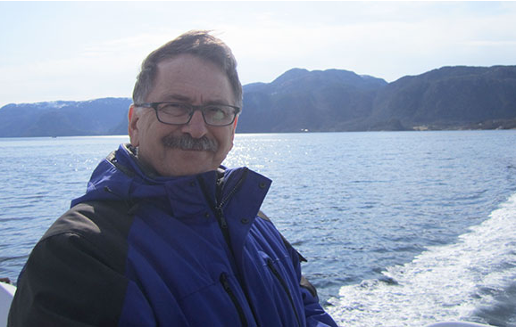 Tim Machan on a boat off the coast of Norway