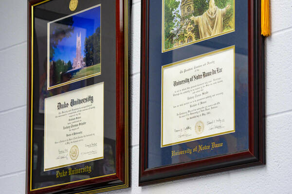 Schafer's diplomas hang in his office.