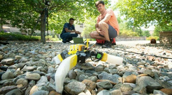 Notre Dame doctoral student Nnamdi Chikere and undergraduate John Simon McElroy, a Naughton Fellow from University College Dublin, testing robotic sea turtle inspired by the adaptable gait of real sea turtles.
