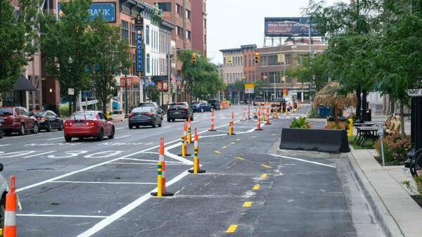 An interim road plan along Michigan Avenue in Kalamazoo, Michigan, features three lanes of one-way traffic with an added bike lane.