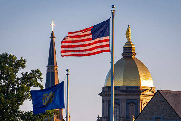 Golden Dome with American flag and Notre Dame flag